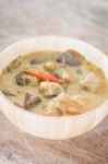 Grren Curry In Wooden Bowl Stock Photo