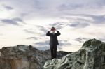 Businessman Using Binoculars Stock Photo