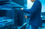 Man Fix Server Network In Data Center Room Stock Photo