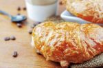 Croissants On Wooden Floor Stock Photo