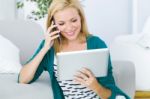 Pretty Young Woman Working And Using Her Mobile Phone Stock Photo