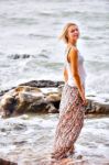 Beautiful Young Blonde Woman Posing Outdoor At The Rocky Sea Sho Stock Photo