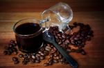 Glass Shot Of Fresh Coffee On Wood Table Stock Photo