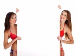 Girls In Bikini Holding Sign Board Stock Photo