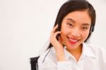 Close-up Of A Young Smiling Female Customer Service Executive Stock Photo