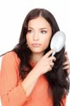 Woman Combing Her Hair Stock Photo