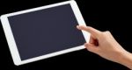 Finger Being Pointed On Tablet Screen Stock Photo