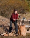 Woman Working With An Axe Stock Photo