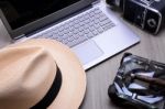 Closeup Of A Wooden Table With Laptop Stock Photo