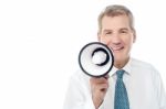 Senior Man Posing With Megaphone Stock Photo