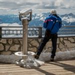 Man Looking At The View From Sass Pordoi In The Upper Part Of Va Stock Photo