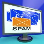 Spam Envelope On Monitor Showing Malicious Messages Stock Photo