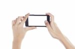 Mobile Phone In Female Hand Isolated On A White Background, To C Stock Photo