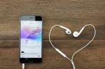 Music App On Iphone 6 And Headphone Stock Photo