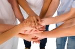 Teenagers With Hands Together Stock Photo