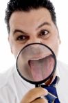 Businessman With Magnified Tongue Stock Photo