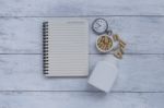 Herb Capsule With Blank Notebook And Vintage Watch Stock Photo