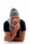 Male Lying And Wearing Woolen Cap Stock Photo