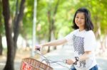 Young Woman Bicycling Stock Photo