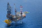 Top View Of Helicopter Pick Up Passenger On The Oil Rig Stock Photo