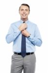 Sales Representative Adjusting His Tie Before The Meeting Stock Photo