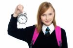 Pretty Charming Schoolgirl Holding Time Piece Stock Photo