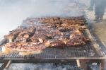 Traditional Meat Grilled On The Grill In The Argentine Countryside Stock Photo