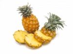 Fresh Pineapple Fruit With Slices On White Background Stock Photo