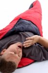 Man In Sleeping Bag And Yawning Stock Photo