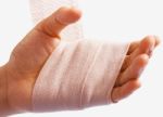 Hand Being Bandaged As Injury Stock Photo