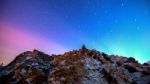 Star Trails Over The Winter Mountains Landscape Stock Photo