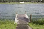 Wooden Dock On Beautiful Forest Lake Stock Photo