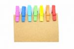 Brown Notepad With Colorful Clip On White Background Stock Photo