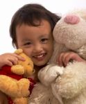 Child Hugging Toys Stock Photo