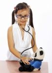 Girl Doctor Checking Her Teddy Stock Photo