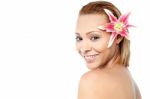 Smiling Woman With Pink Lily Flower Stock Photo