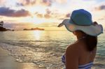 Girl On The Beach At Sunrise Stock Photo