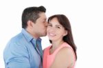 Close-up Portrait Of Woman Being Affectionately Kissed By Her Hu Stock Photo