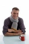 Smiling Young Man With Coffee Mug Stock Photo