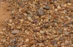 Textured Background Of Stones And River Sand Stock Photo