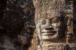 Ancient Stone Face Of Bayon Temple Stock Photo