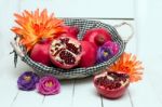 Fresh Pomegranate Fruits Isolated On A White Wooden Background Stock Photo