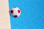 Red-white Beach Ball Floating  In Swimming Pool Stock Photo