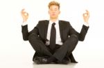 Businessman Doing Yoga Stock Photo