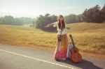 Hippie Girl Hitchhiking Stock Photo