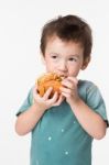 Boy Eating A Burger Stock Photo