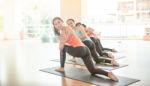 Asian Woman Doing Yoga Indoors Stock Photo