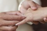 Groom Put An Engagement Ring Stock Photo