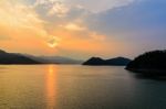 Sunset Over A Mountain At Lake Stock Photo