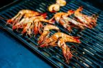 Grilled King Size Prawns On Fire Stock Photo